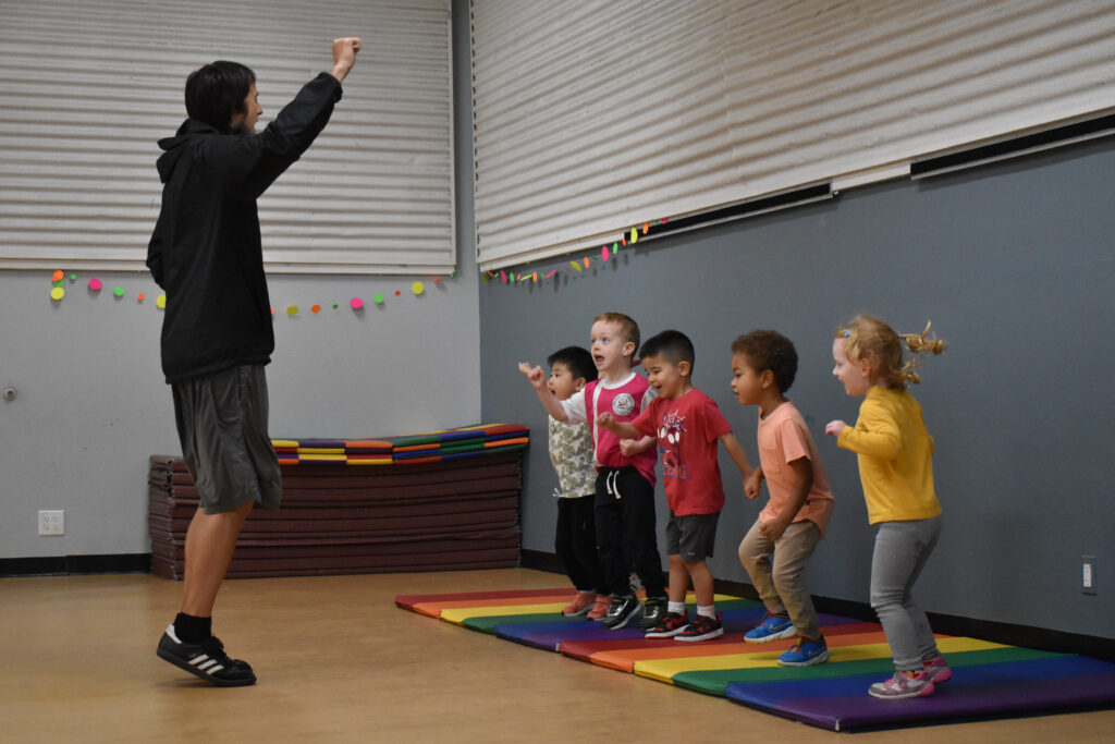 Students celebrate together in soccer class